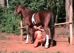 Horny redhead is banged hard by a great horse
