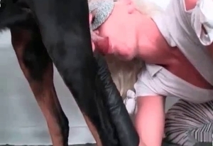This girl with blonde hair wants to worship the cock of a dog